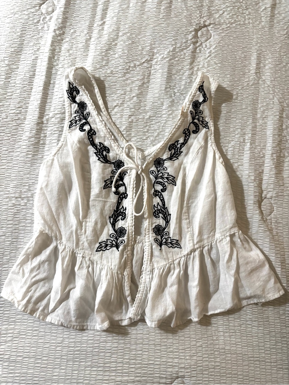 Women's White Sleeveless Peplum Top with Black Embroidery